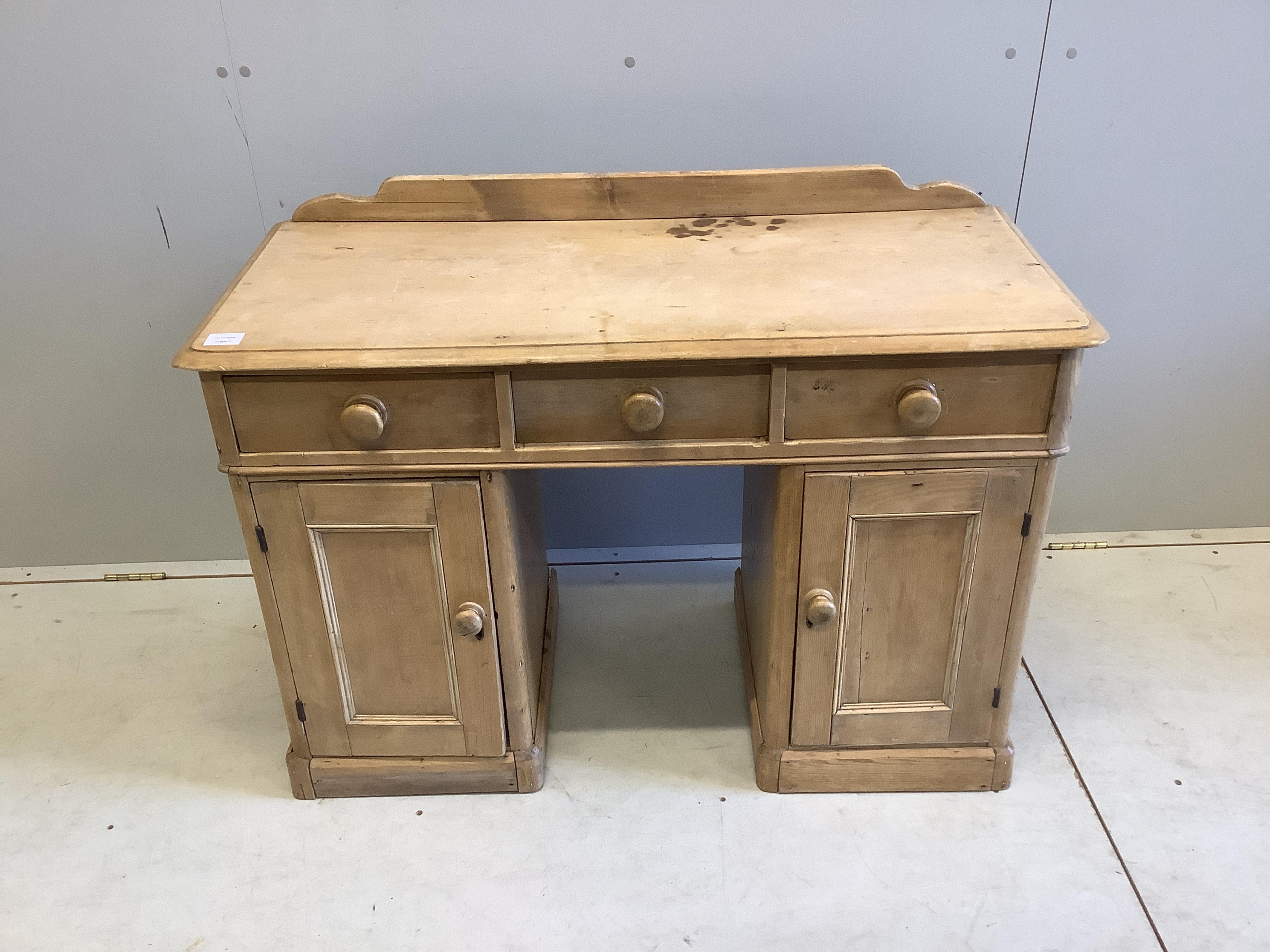 A Victorian pine kneehole dressing table, width 106cm, depth 46cm, height 80cm. Condition - fair